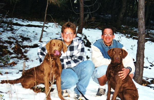 Michael and Danny sitting with dogs